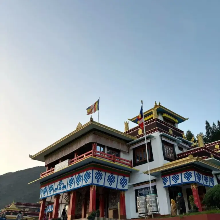 A Buddhist monastery with colorful decorations and flags in Bomdila, Arunachal Pradesh