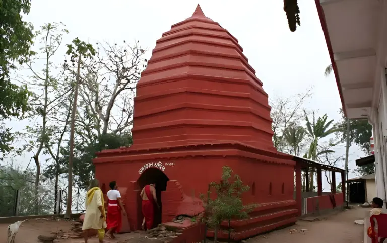 Devotees entering the red-colored Umananda Temple on Umananda Island in Assam