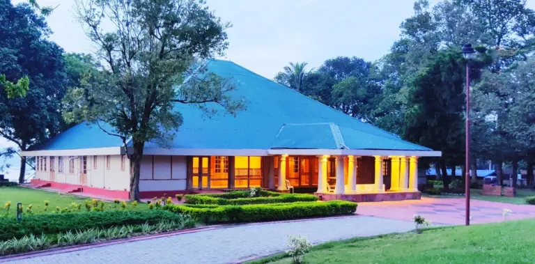 Exterior view of the Brahmaputra Heritage Centre building in Assam, surrounded by greenery