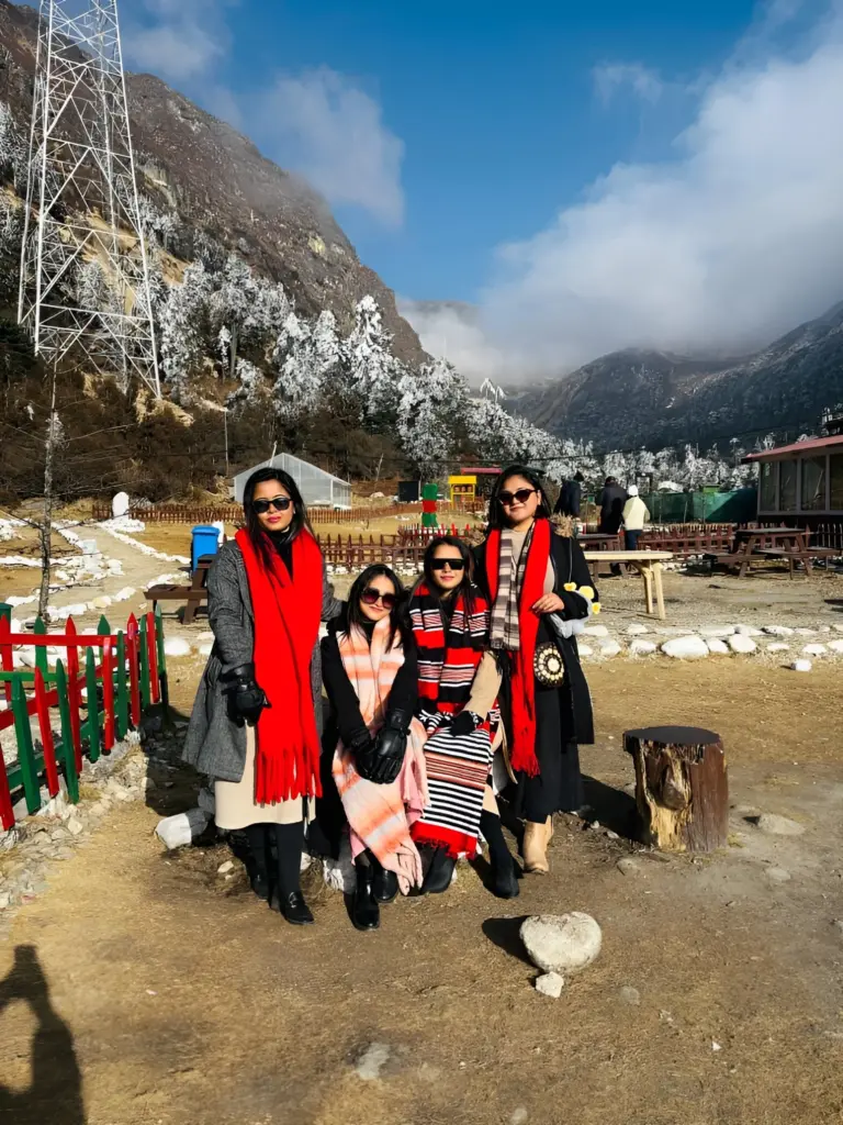 Four women at snowy Sela Pass, Arunachal Pradesh