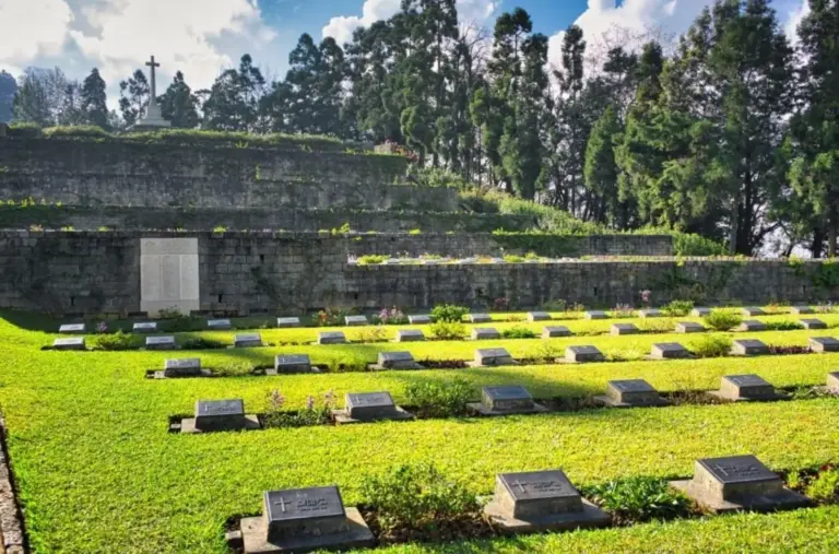 Graves and memorial cross at Kohima War Cemetery