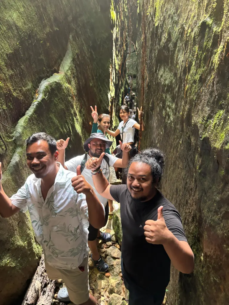 Group of people exploring the split rock trek at Mawlyngbna Meghalaya