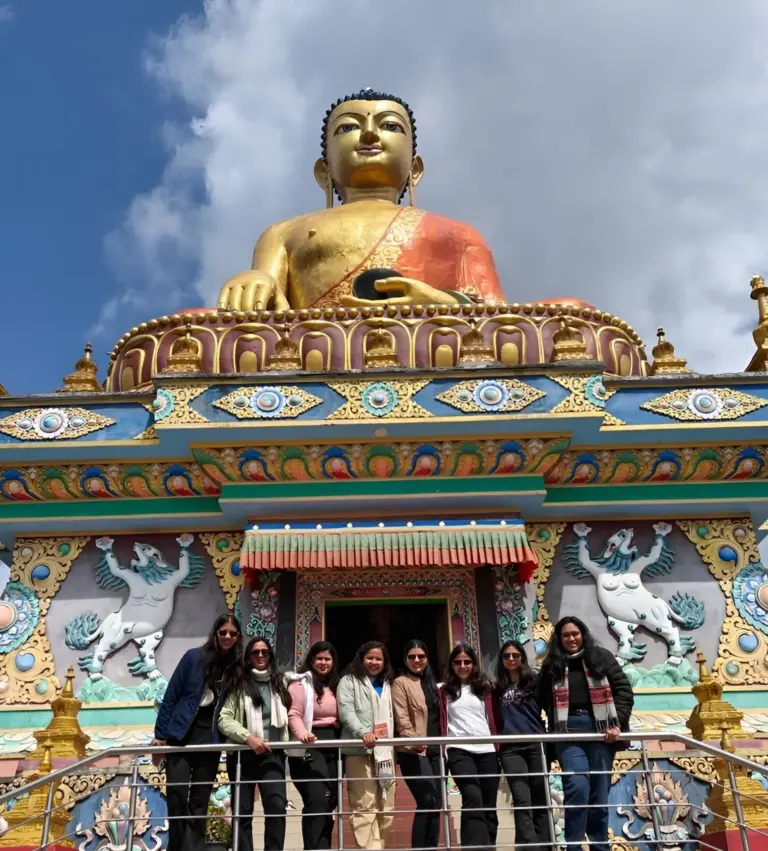 Group photo in front of Buddha statue at Tawang Monastery, Arunachal Pradesh