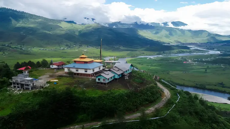 Hilltop monastery overlooking lush green valley in Mechuka, Arunachal Pradesh