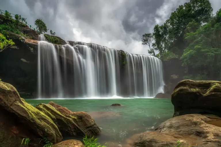 Karang Suri Falls in Meghalaya with smooth flowing water and lush greenery
