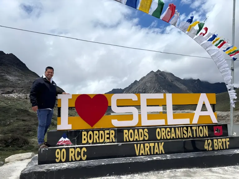 Man at “I ❤️ SELA” sign in Sela Pass, Arunachal Pradesh