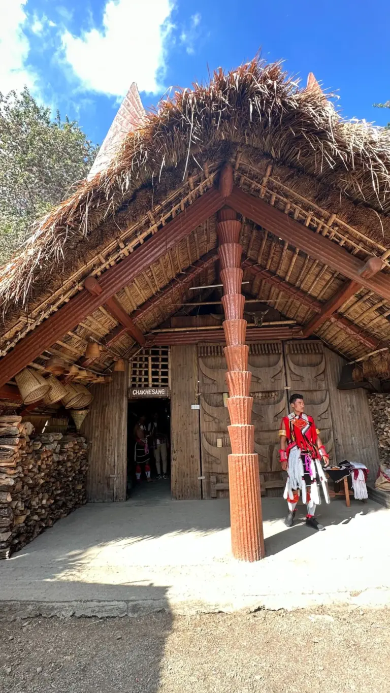 Morung hut with a Naga tribesman in traditional attire