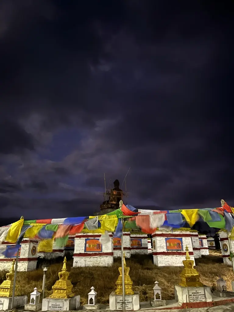Night view of Mandala Top with prayer flags and stupas