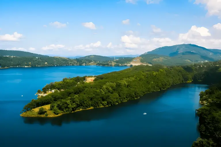 Scenic view of Umiam Lake surrounded by green hills in Meghalaya