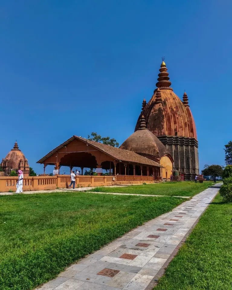 Shiva Doul temple with clear sky and green lawn in Assam