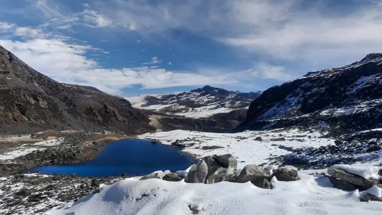 Snowy mountains and blue lake at Bumla Pass, Arunachal Pradesh
