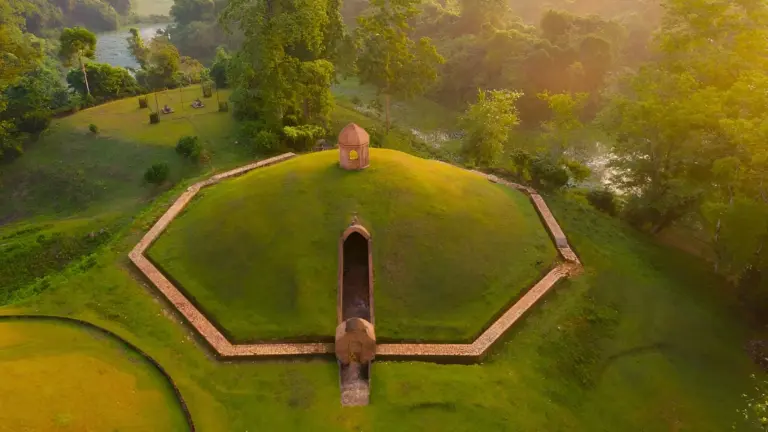 Sunlit view of a royal burial mound at Charaideo Maidam, Assam