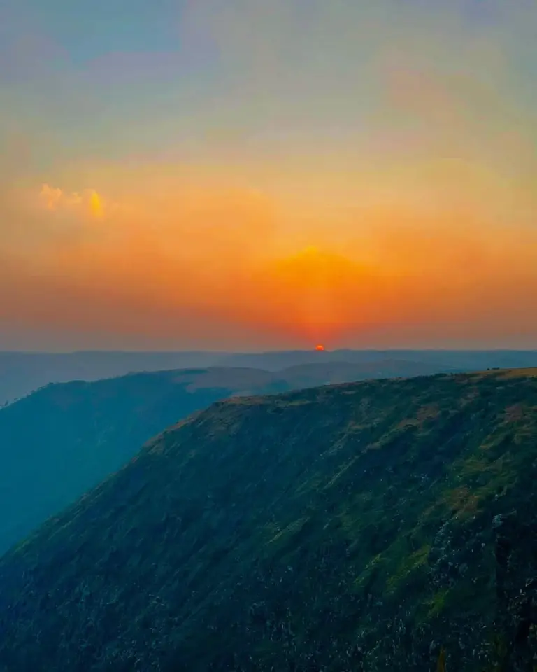 Sunset over the hills at Laitlum, Meghalaya with a glowing orange sky