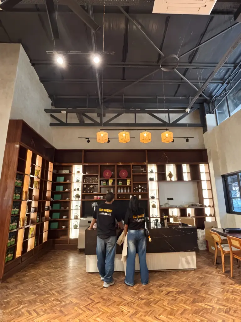 Visitors at a tea counter inside a modern tea tasting room in Guwahati Assam
