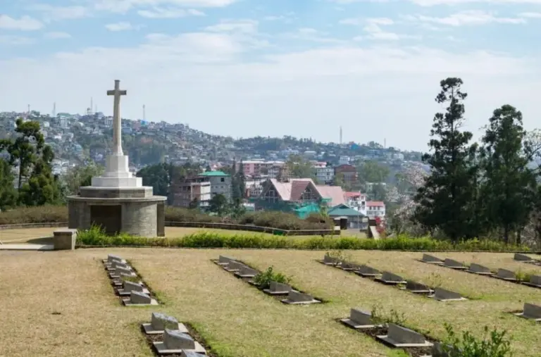War graves and memorial cross at Kohima War Cemetery