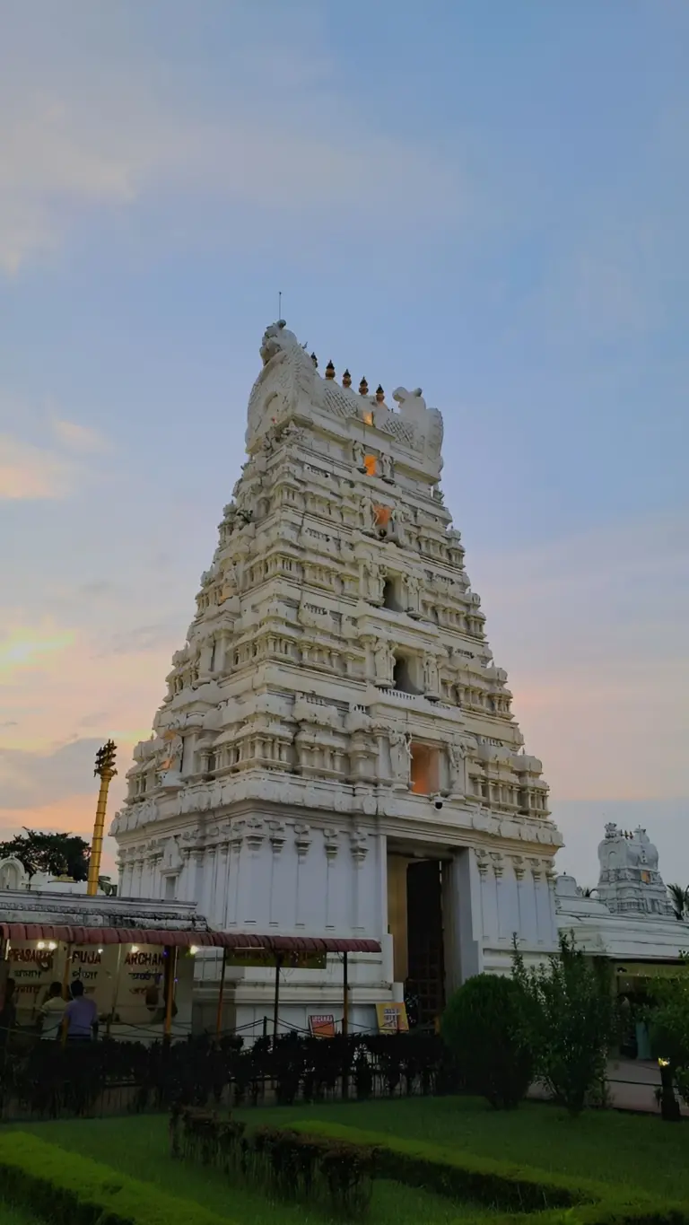 White Balaji temple tower at sunset in Assam
