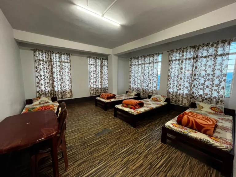 Triple sharing room with three beds at Ember Homestay