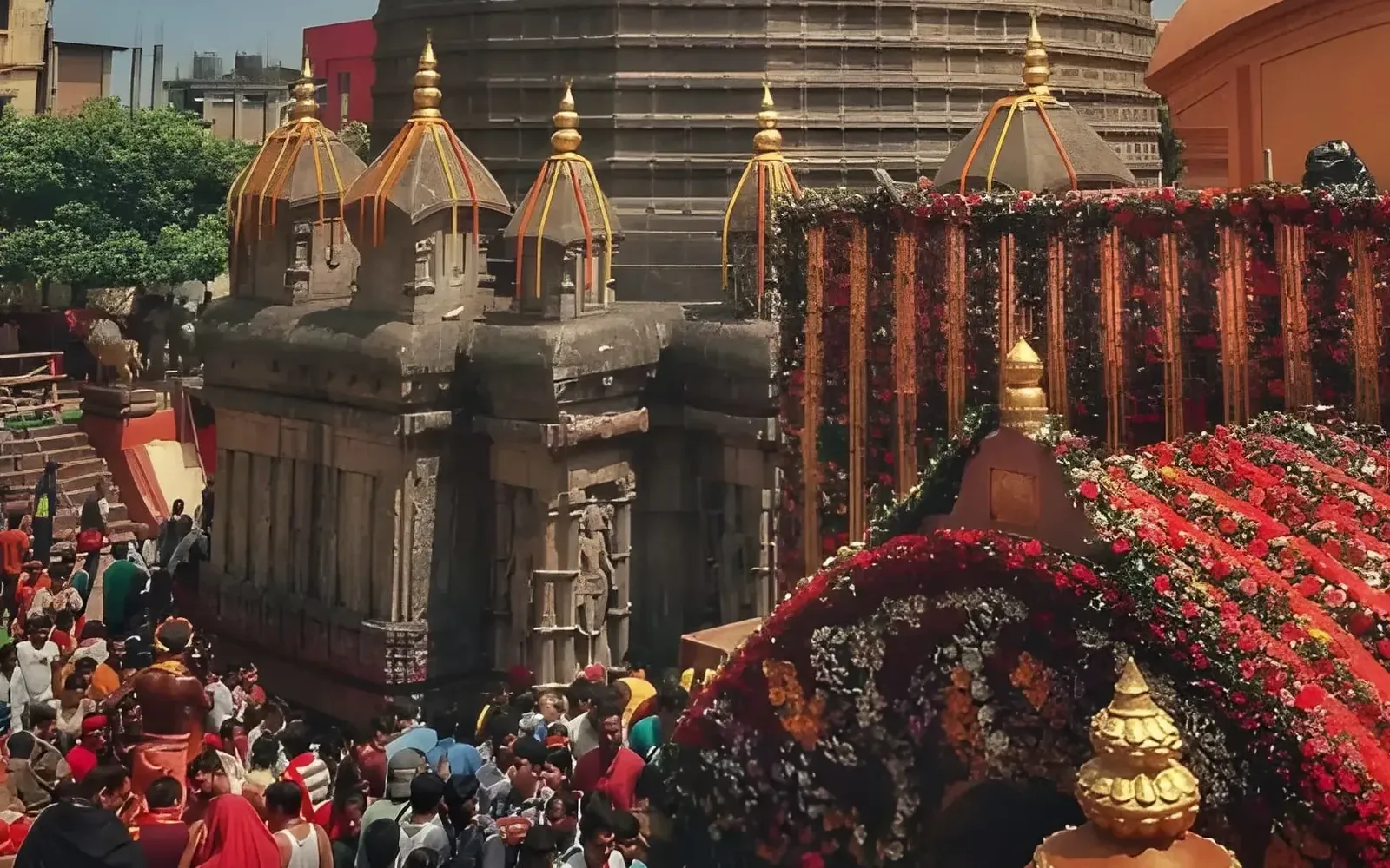 Kamakhya Temple decorated with flowers and devotees gathered outside