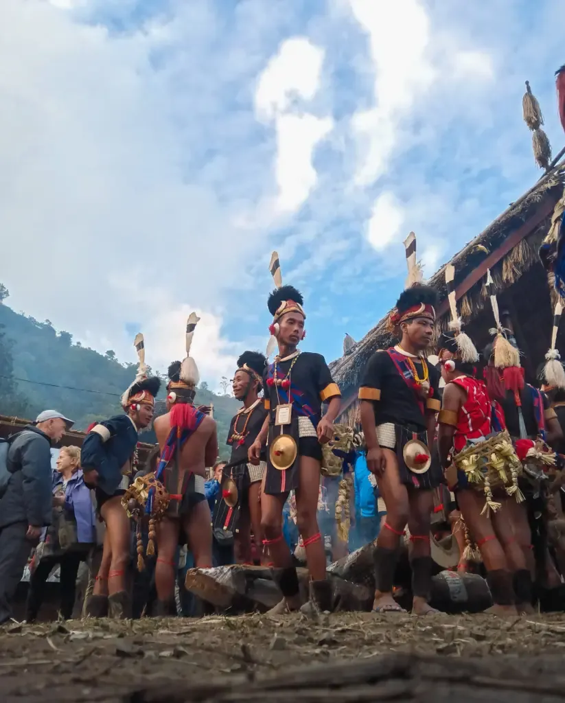 Naga men in traditional attire performing at the Hornbill Festival, Nagaland