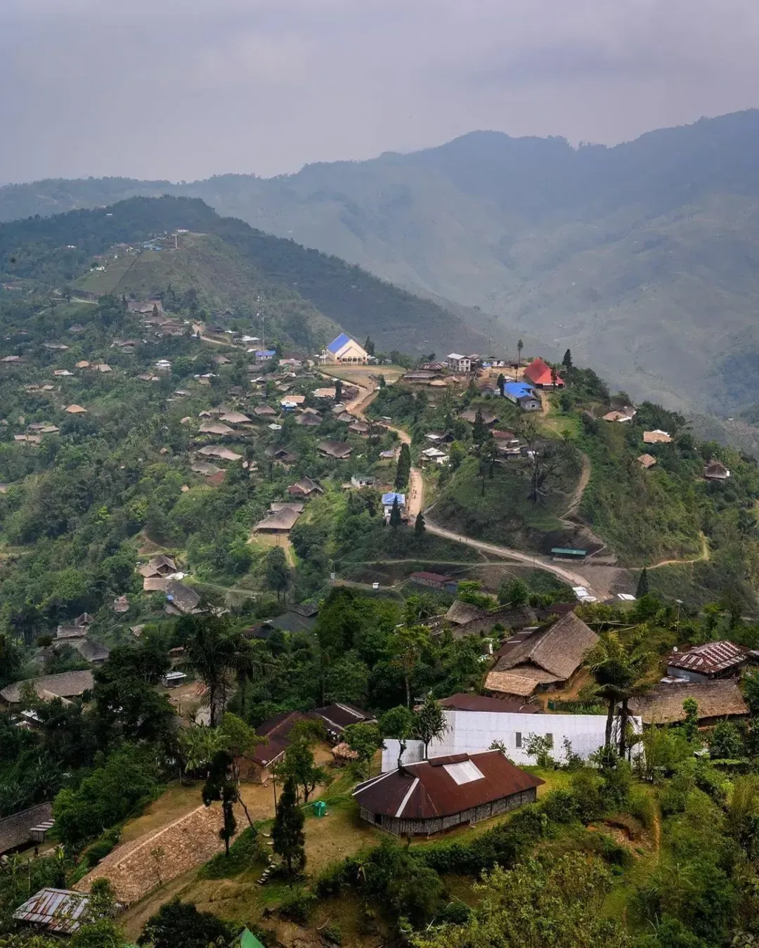 Panoramic view of Longwa village nestled amidst the lush hills of Nagaland